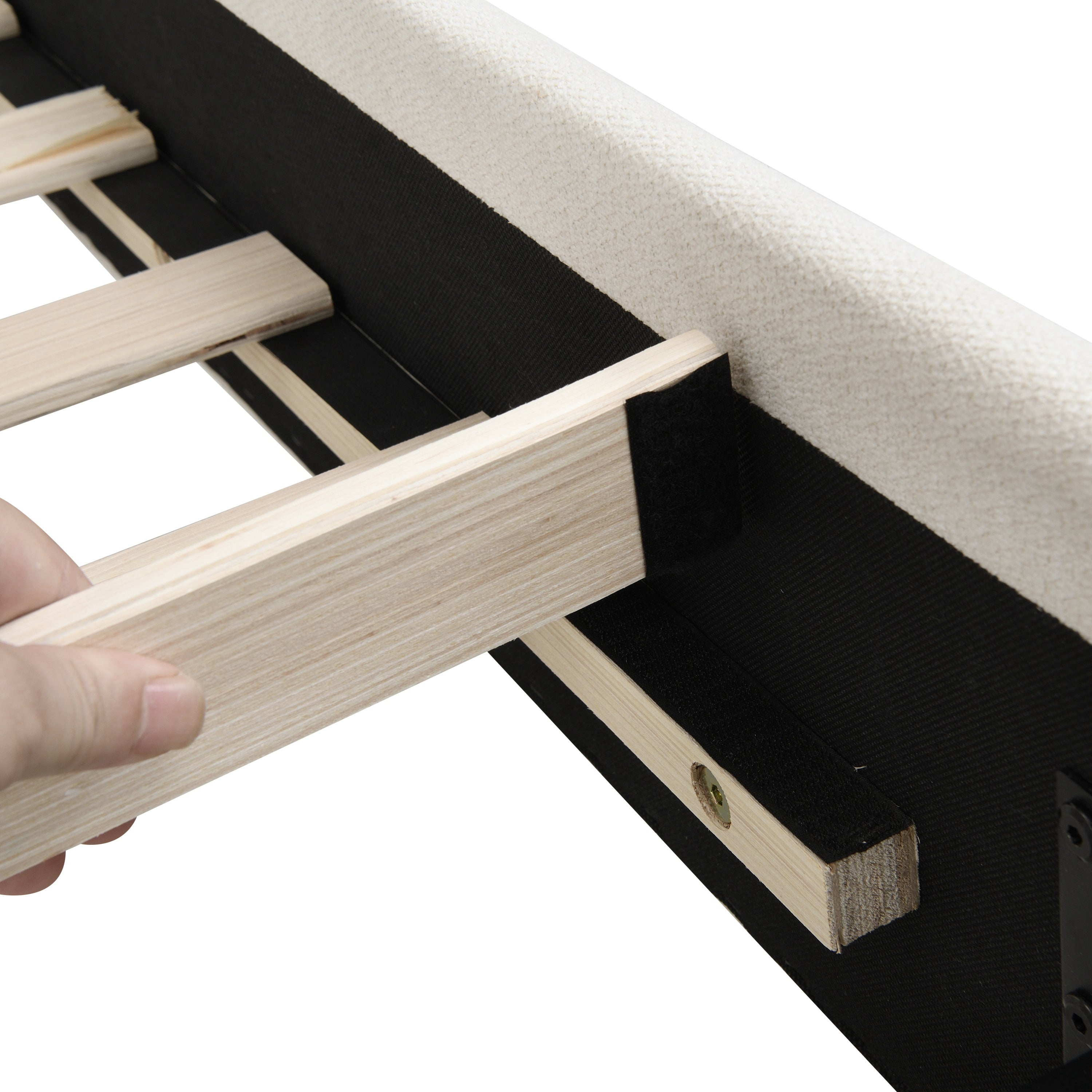 Hand installing a wood slat on the beige chenille platform bed frame, close-up #Color_Beige