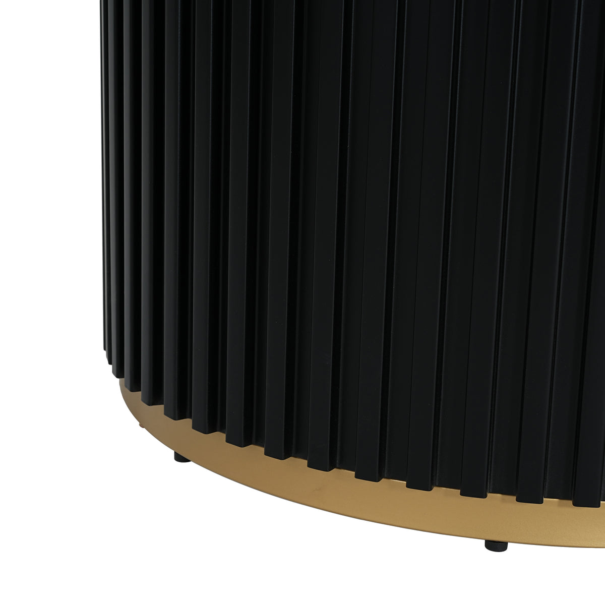 Close-up of the fluted black pedestal base and gold base ring