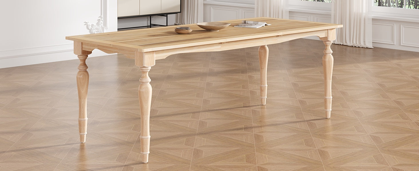 Wide angled view of the solid wood dining table with turned legs in a bright paneled room