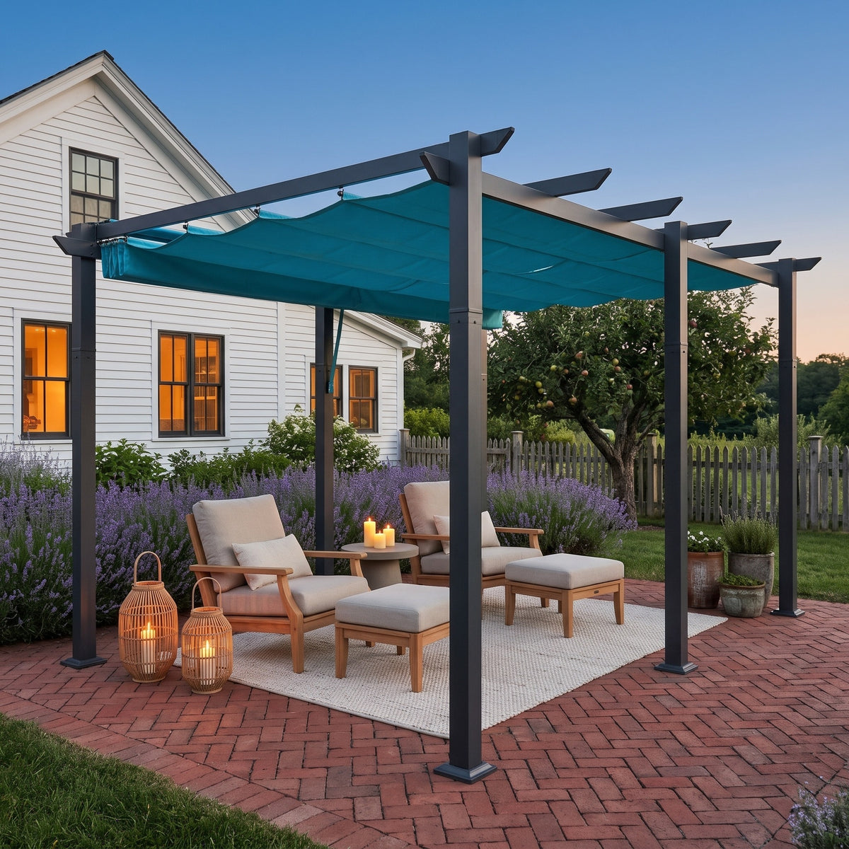 Lake blue aluminum pergola over two lounge chairs with ottomans on a brick patio at dusk, lanterns glowing