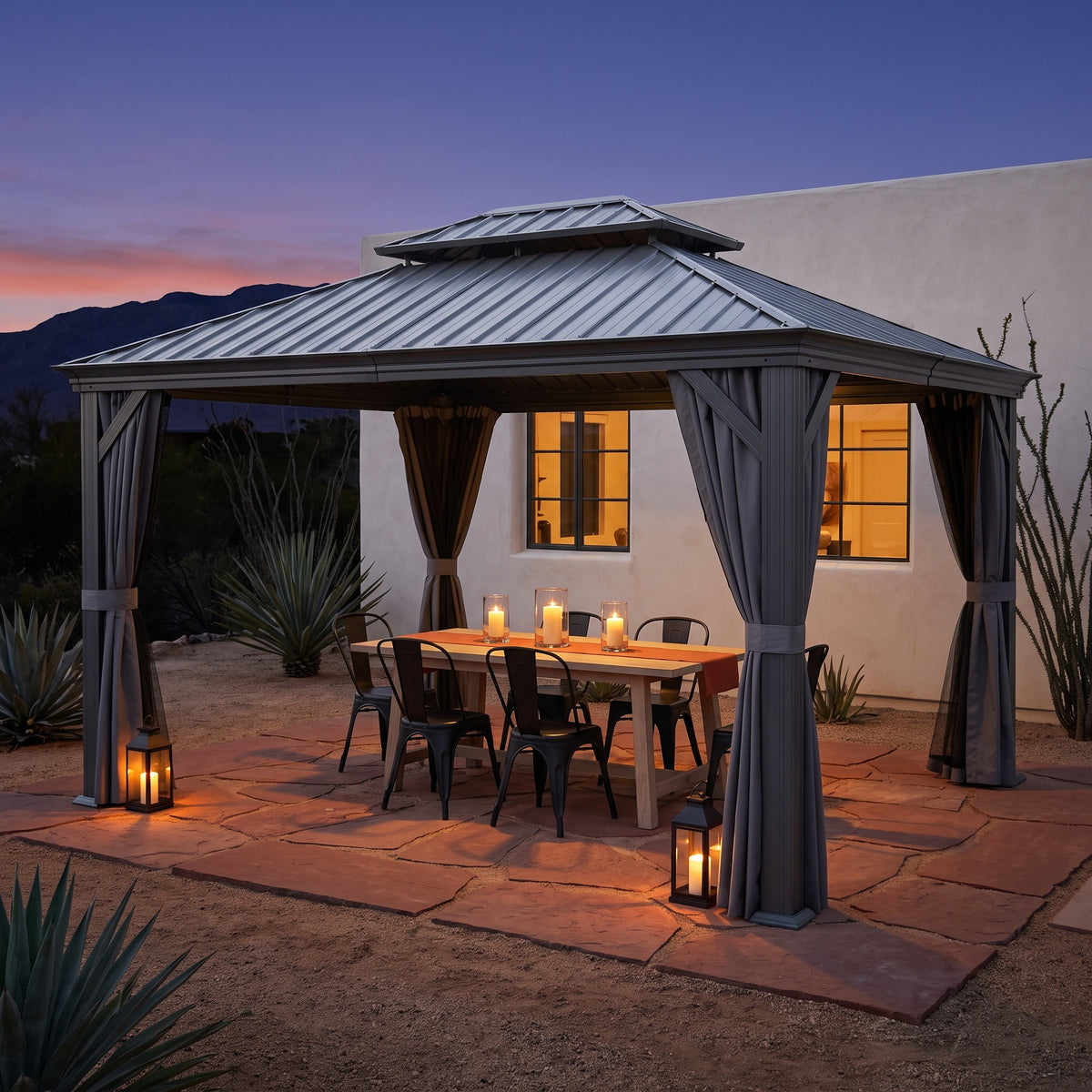 Gray aluminum 12x14 double roof hardtop gazebo with tied back curtains over a candlelit dining table at dusk