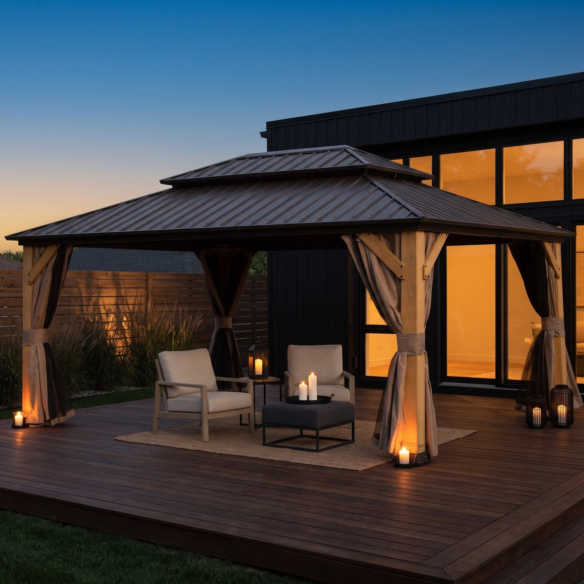 Brown cedar 12x16 double roof hardtop gazebo with tied curtains over lounge chairs on a deck at dusk
