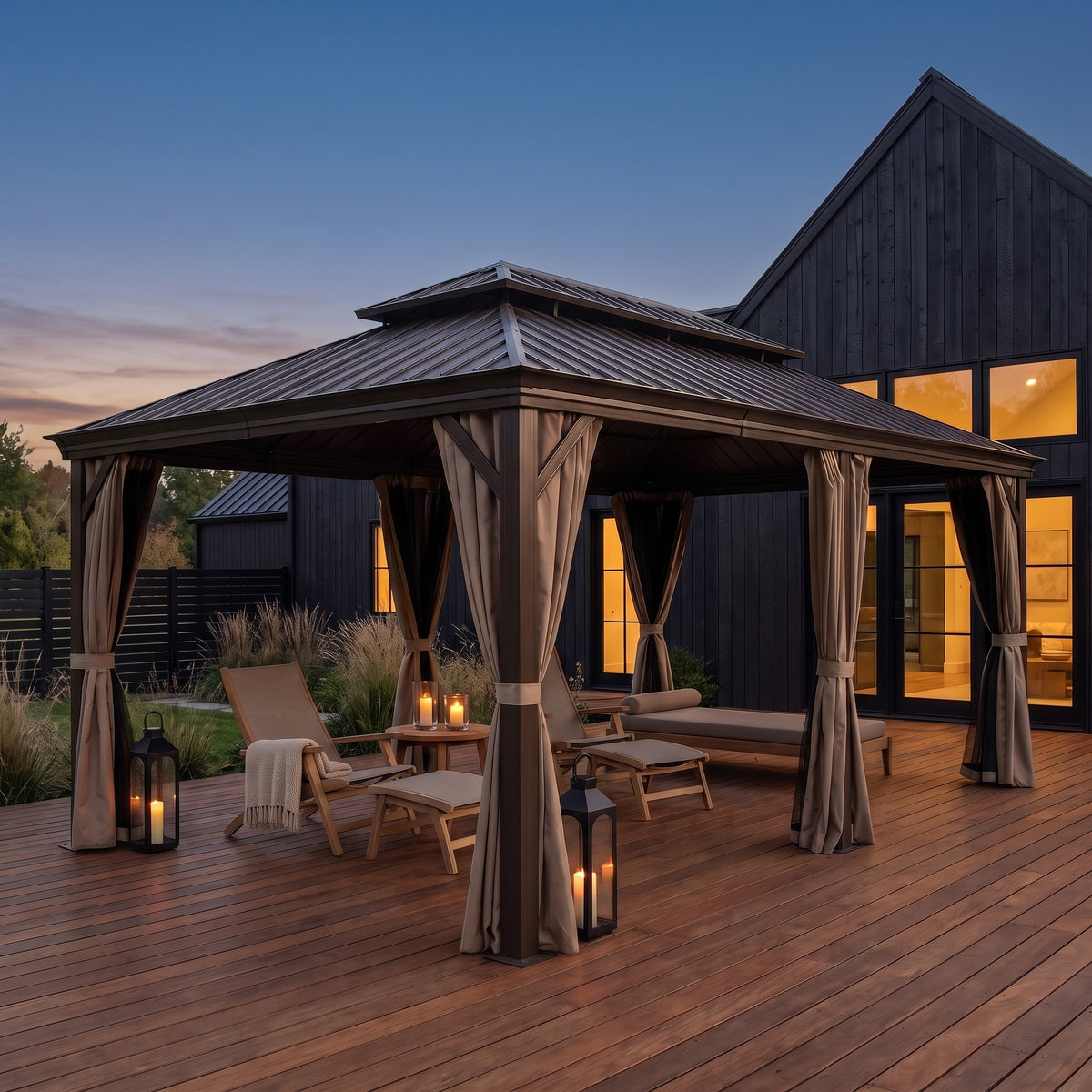Brown aluminum 12x20 double roof hardtop gazebo with tied back curtains over lounge chairs on a wood deck at dusk