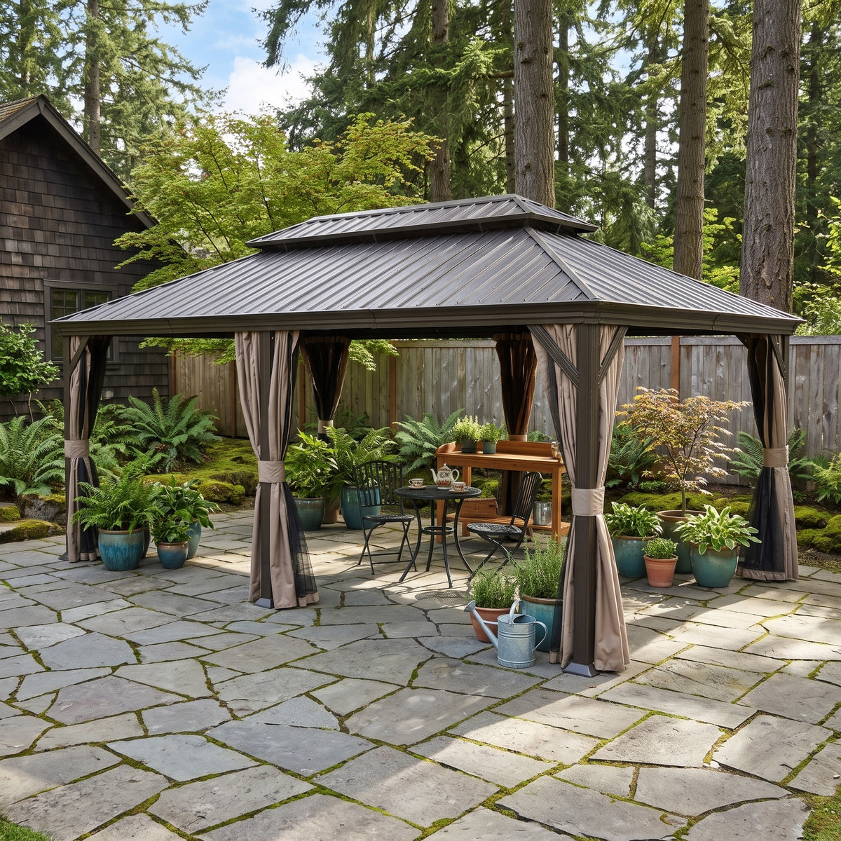 Brown 12x20 hardtop gazebo with tan curtains over a bistro table on a stone patio among tall pines