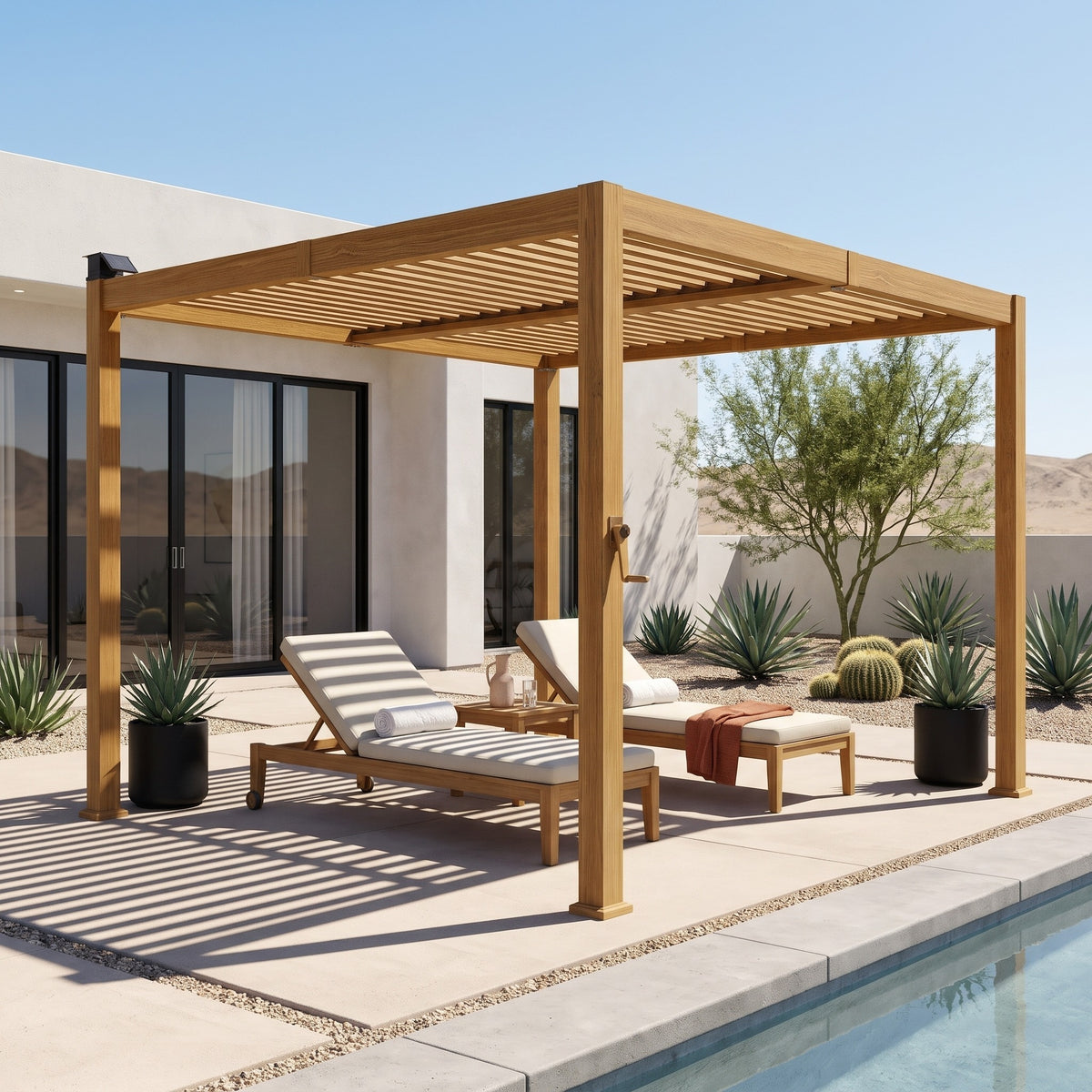 Brown louvered metal pergola shading two cushioned chaise lounges on a concrete pool patio in desert sun