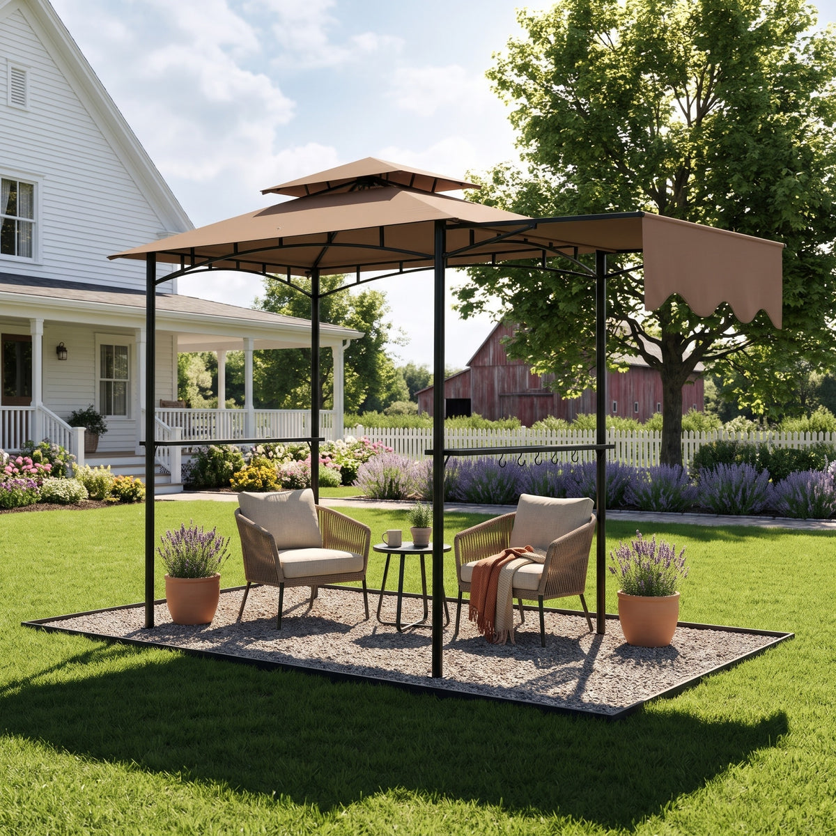 Brown double roof grill gazebo with side awning and shelves over two wicker chairs on gravel in a farmhouse yard