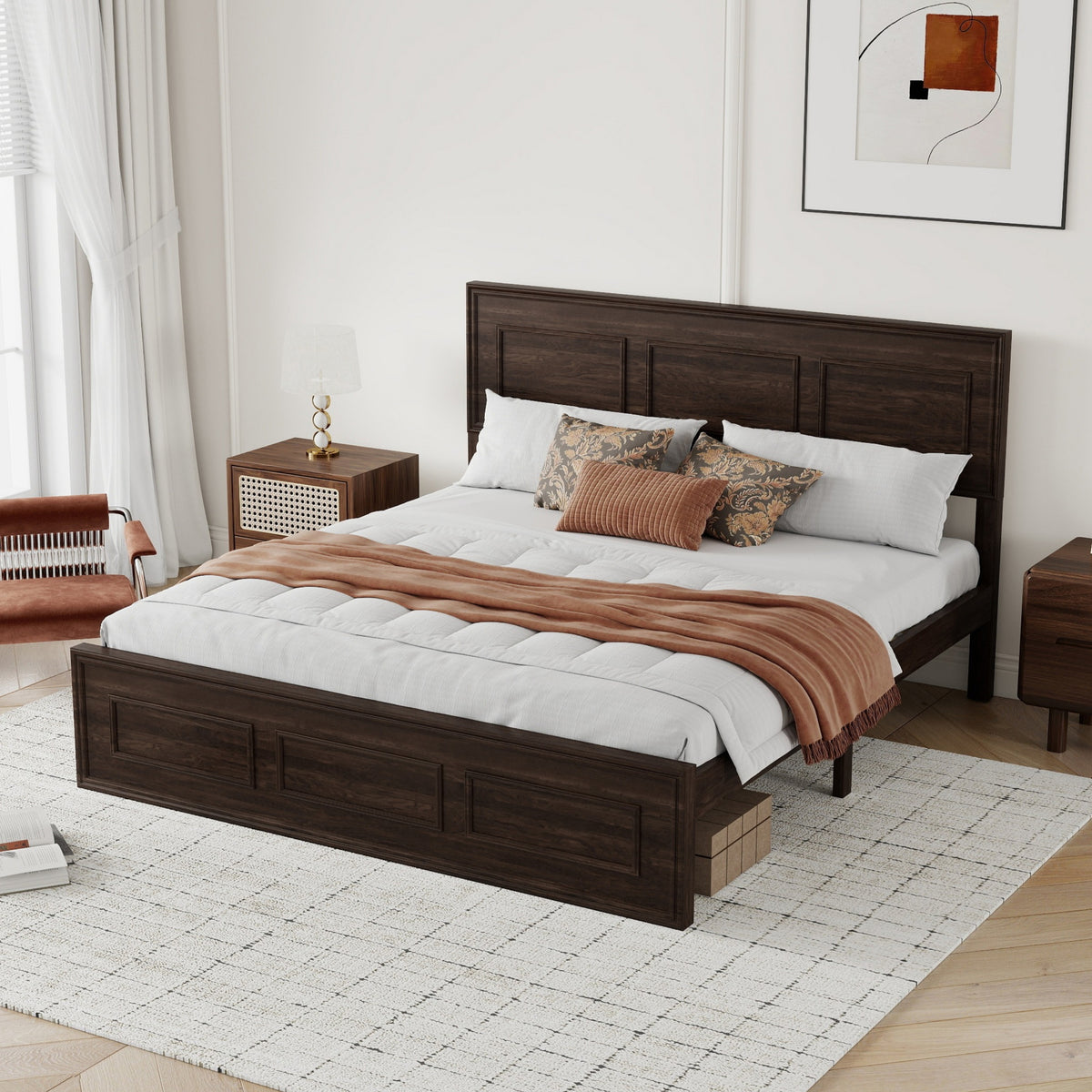 Left-angle view of rich brown wood queen bed dressed in white and rust bedding