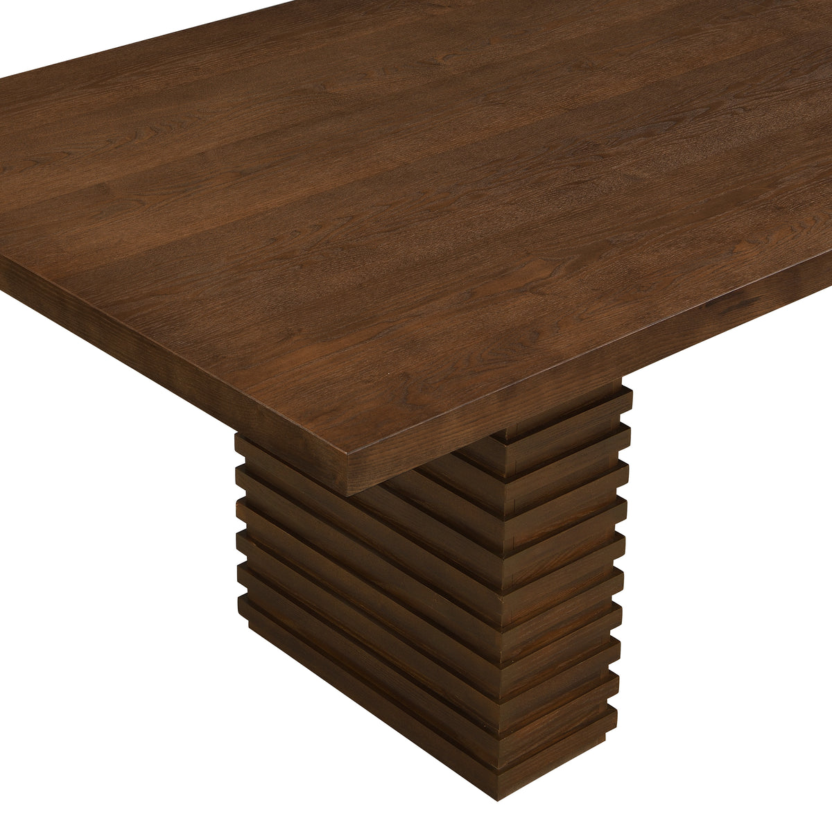 Close-up of a tabletop corner above the stacked-slat pedestal base on the walnut dining table