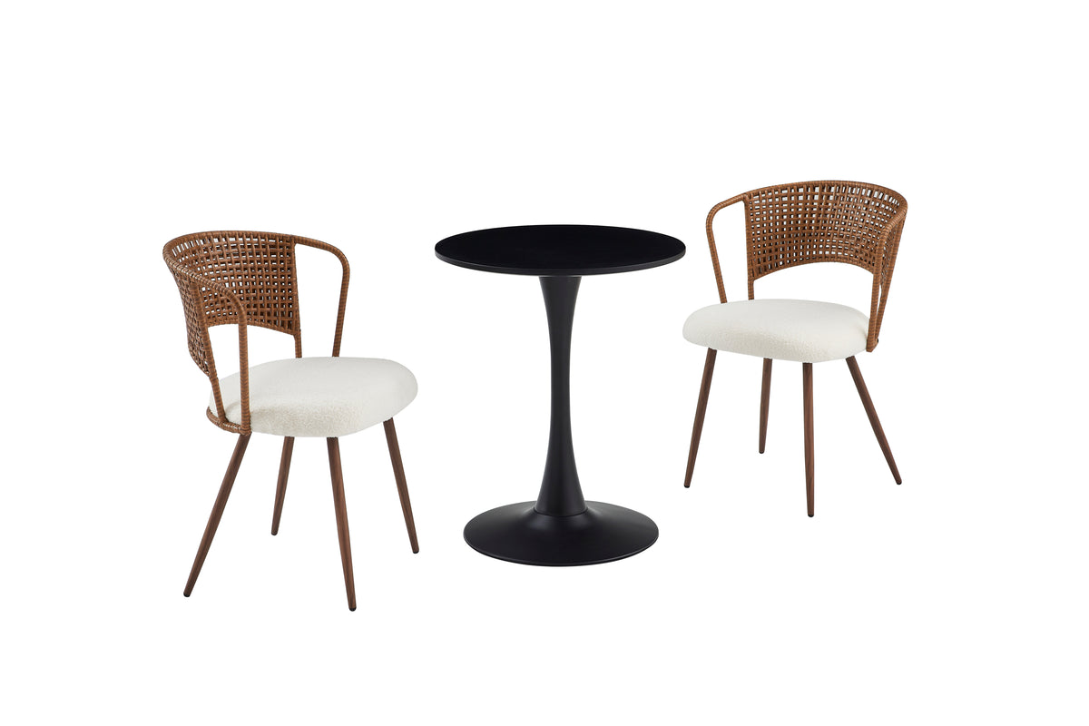 Black round bistro table with black tulip base flanked by two woven chairs, white studio
