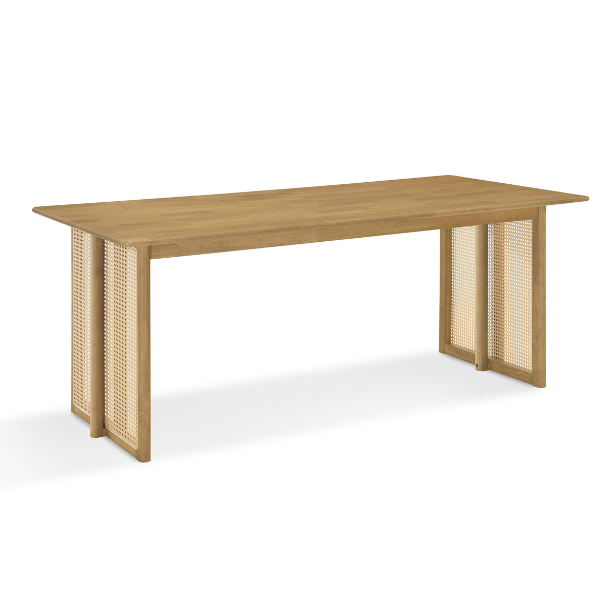 Three-quarter studio view of the natural solid wood dining table with woven cane panel legs, white background