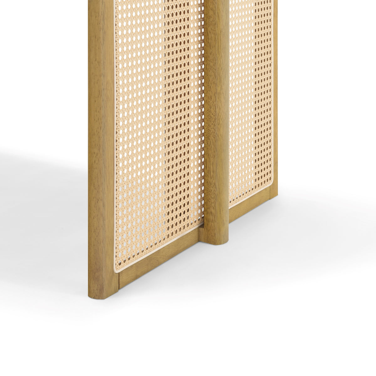 Close-up of a woven cane panel leg base on the natural solid wood dining table, white background