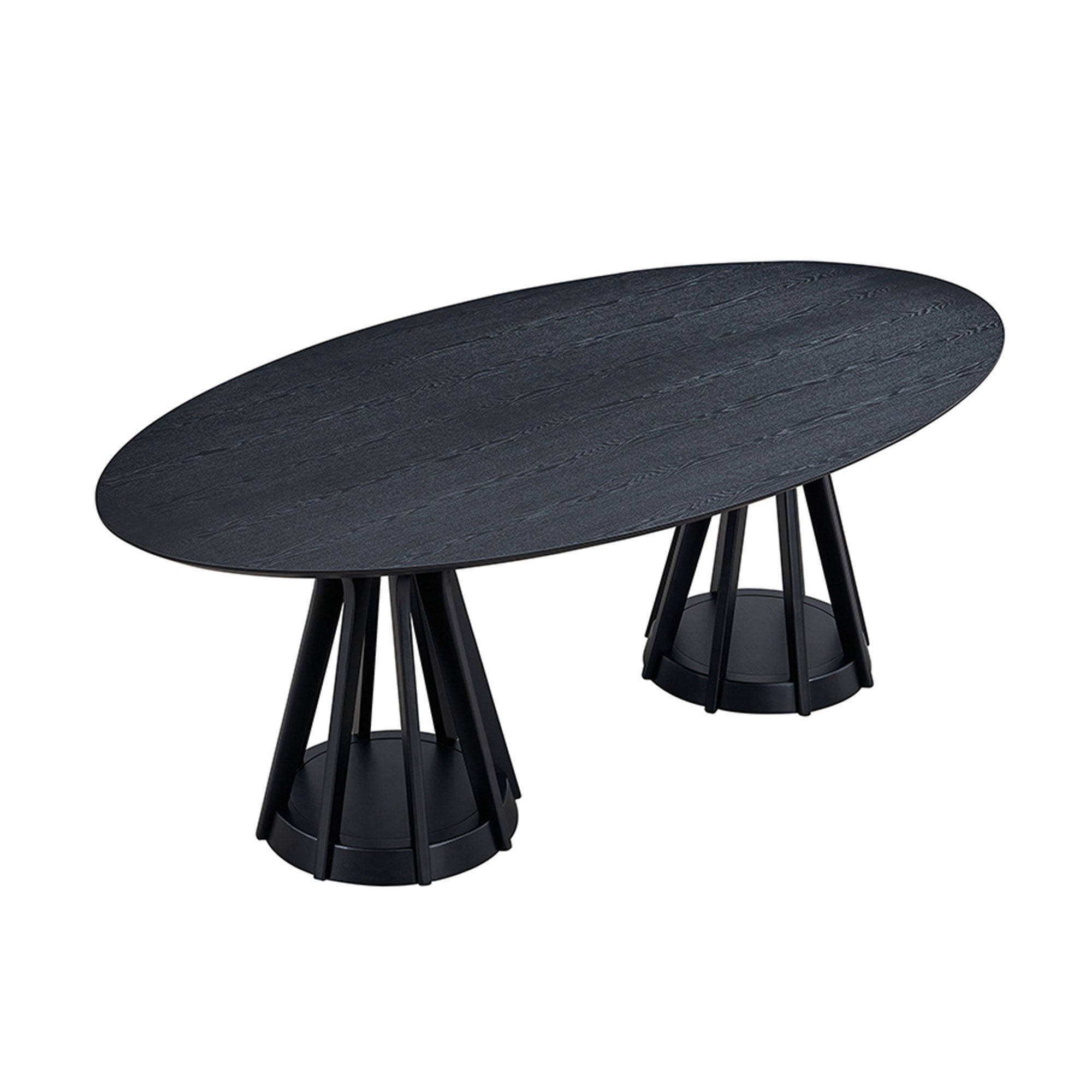Overhead three-quarter view of the black oval pedestal dining table on white