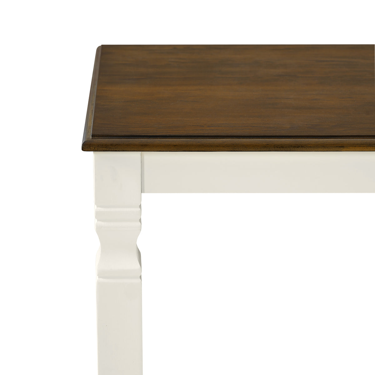Close-up of the beveled brown tabletop edge and white farmhouse leg on white studio background