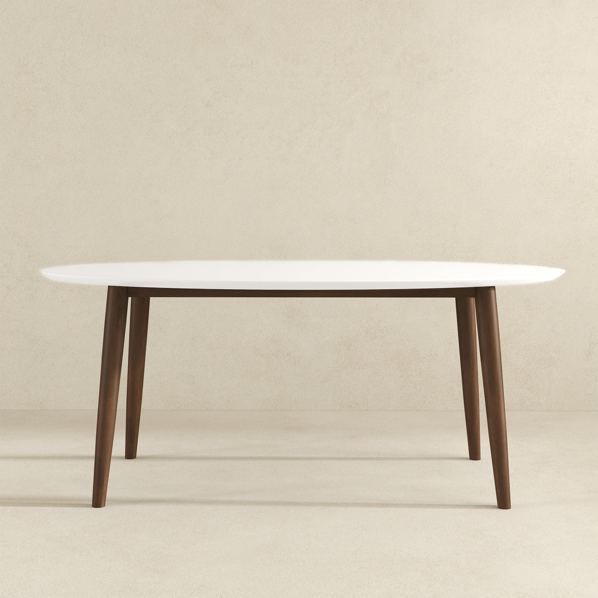 White-top oval dining table, front view on a beige studio background