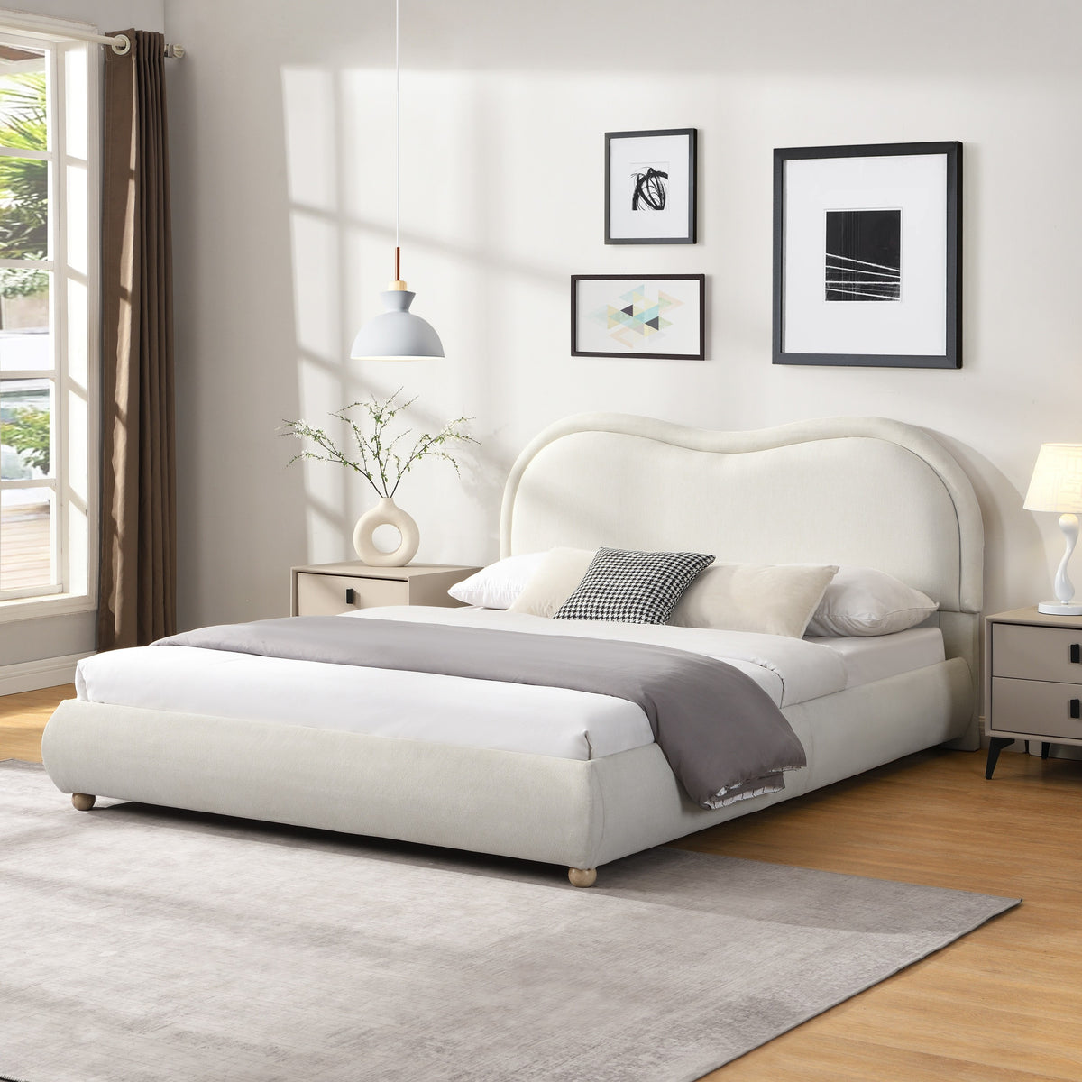 Angled beige chenille platform bed with curved headboard and white bedding in a styled bedroom