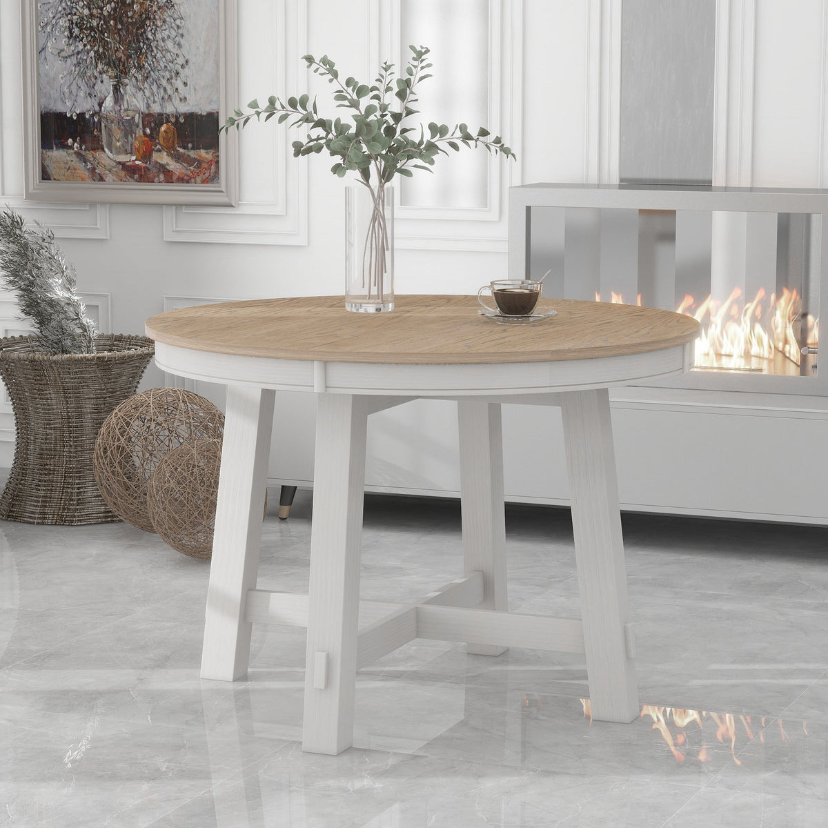 Front view of the oak-top round extendable dining table with antique white base near a fireplace