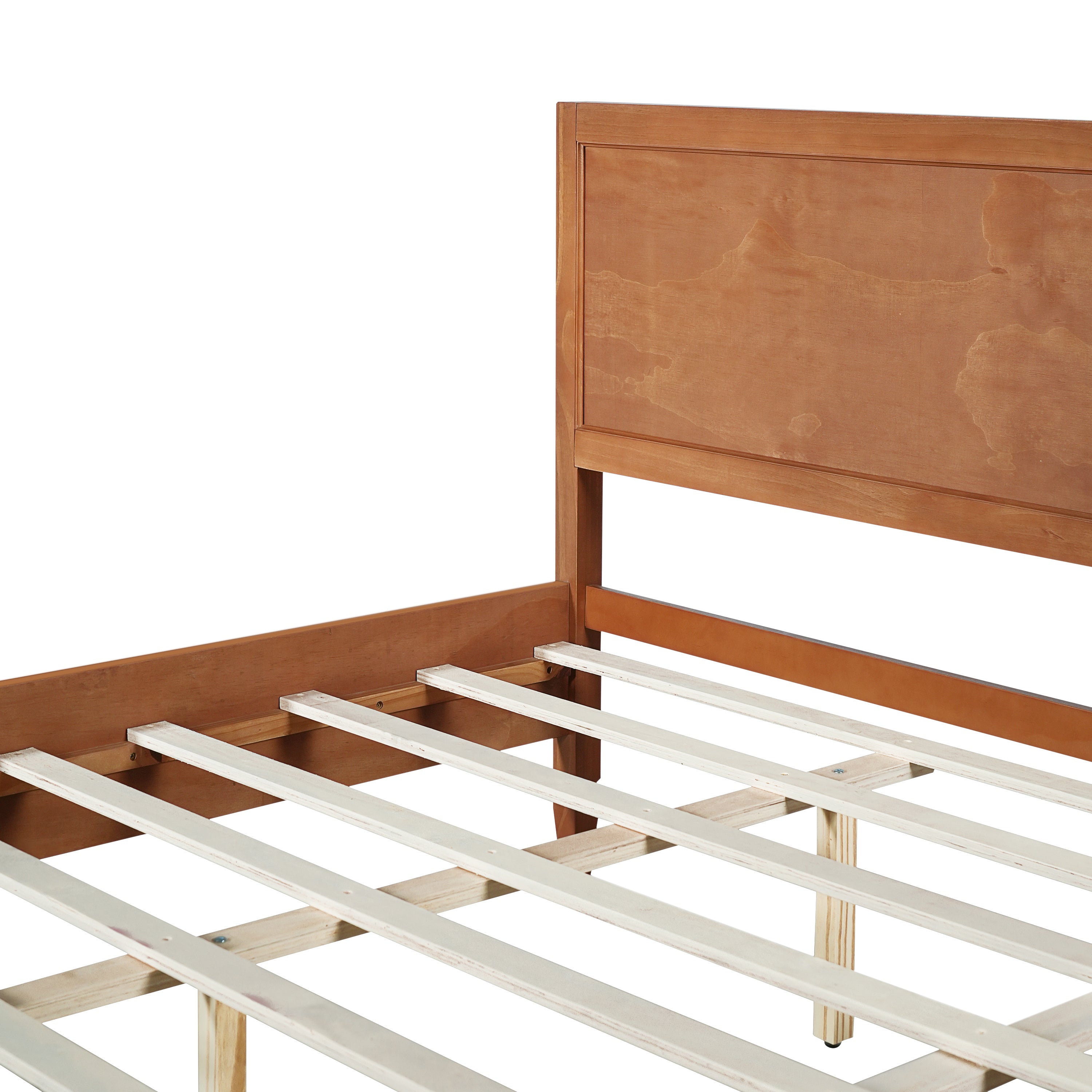 Close-up of the headboard-to-rail joint on the brown platform bed above the exposed wood slats