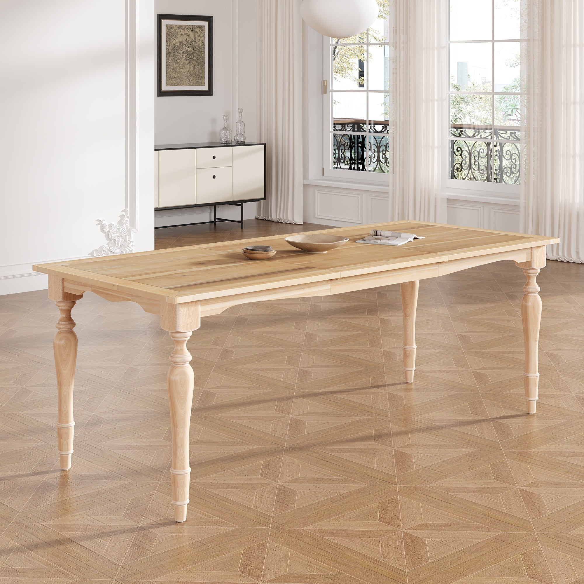 Extendable solid wood dining table with turned legs styled in a bright room with wood bowls