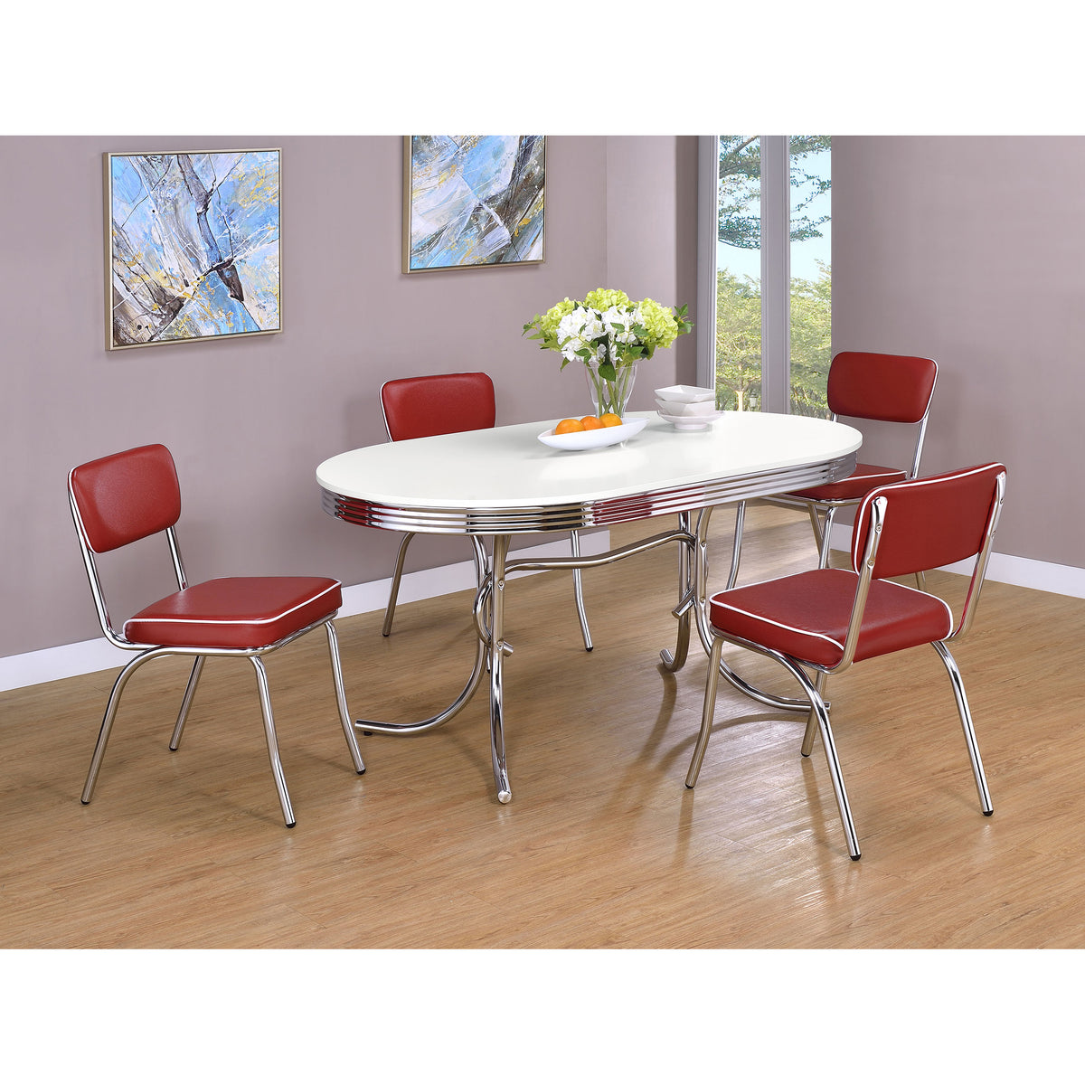 Styled dining set with the retro oval table and four red upholstered chrome chairs