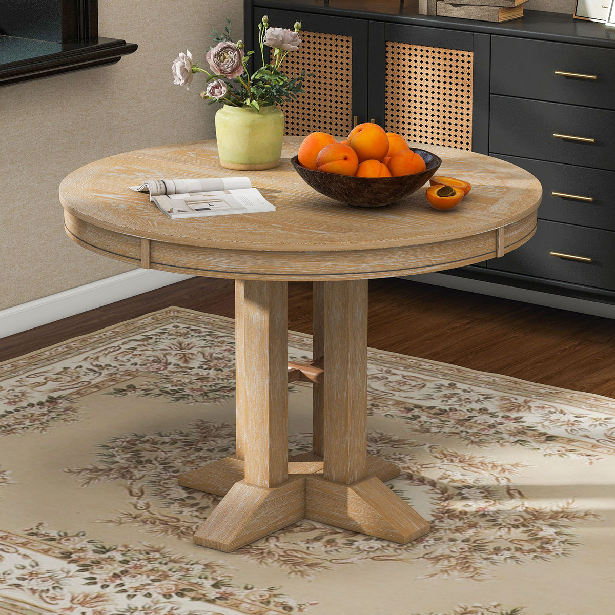 Overhead view of the round natural oak table in a styled room