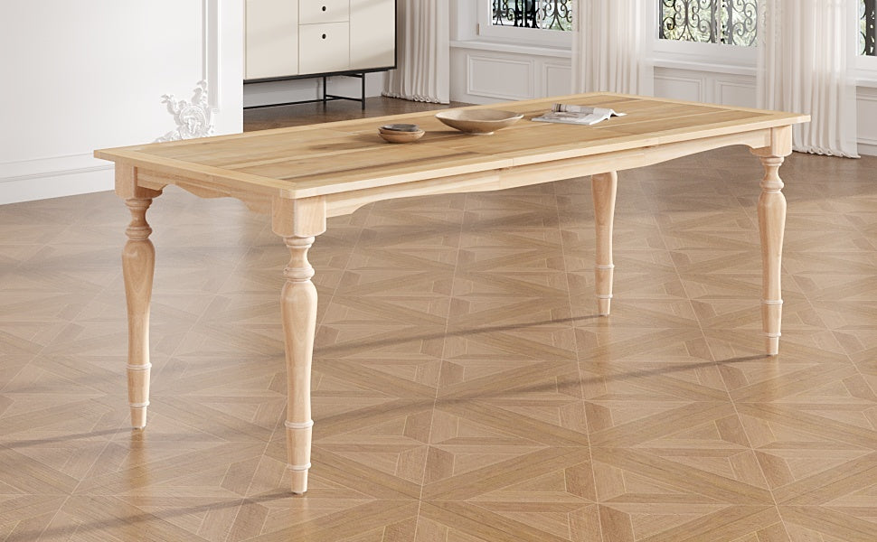 Natural solid wood dining table with turned legs staged in a sunlit paneled dining room