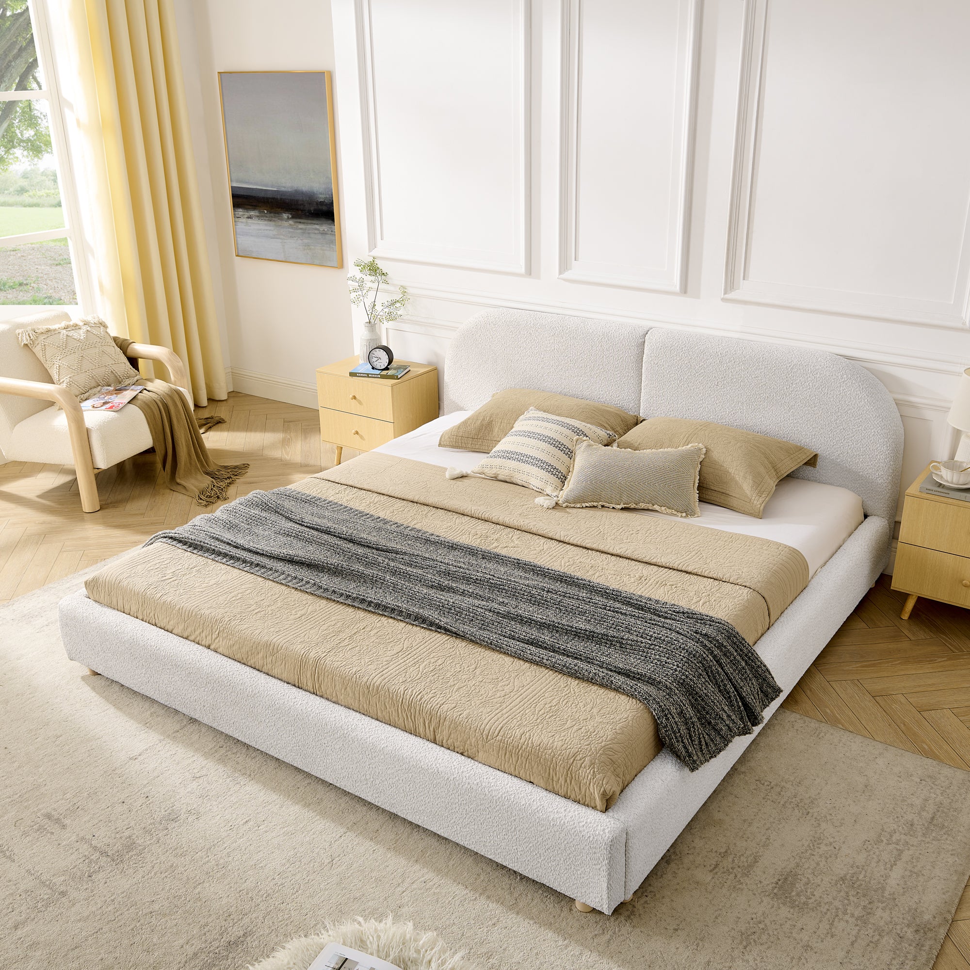 Beige curved headboard king bed, angled bedroom view with yellow curtains