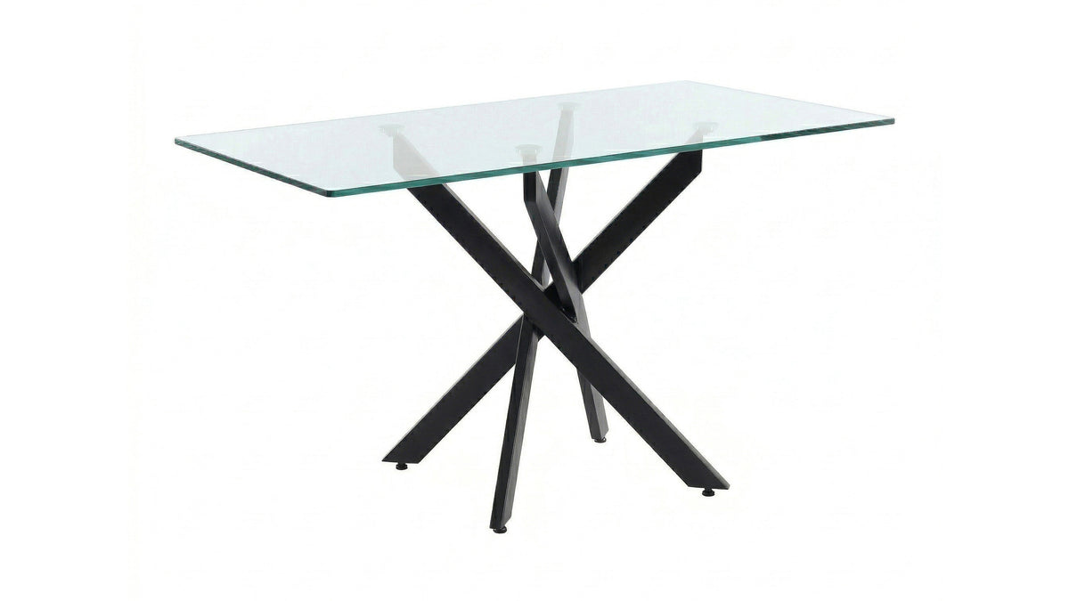Wide angled view of the clear glass table with black X-shaped base on a white background