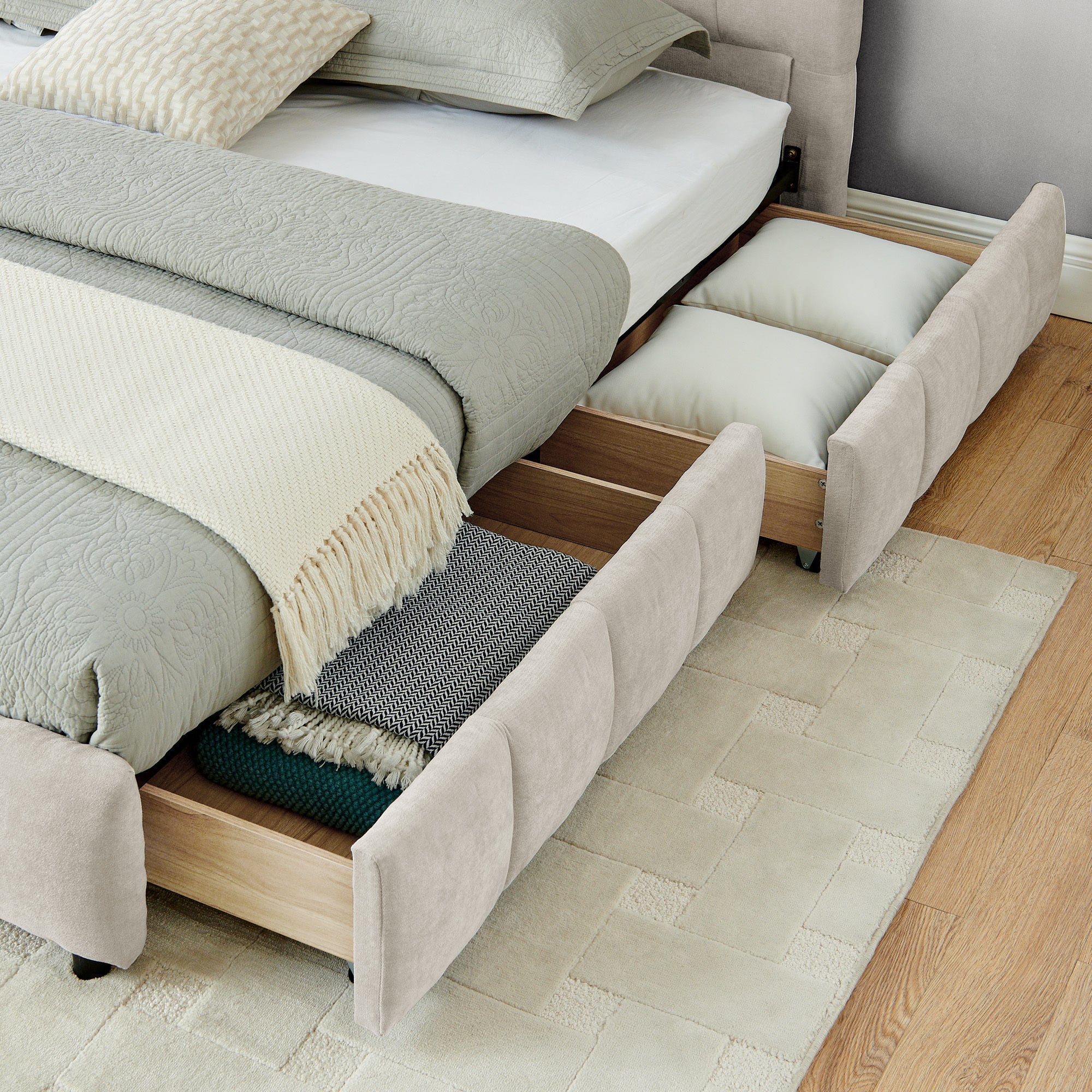 Close-up of drawer caster wheel and beige chenille side panel