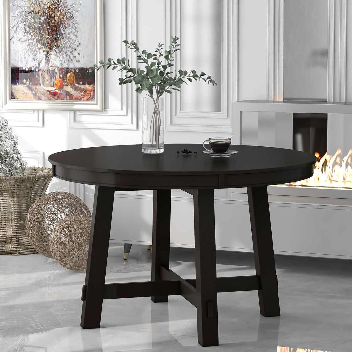 Espresso round dining table unextended, styled in a bright paneled dining room