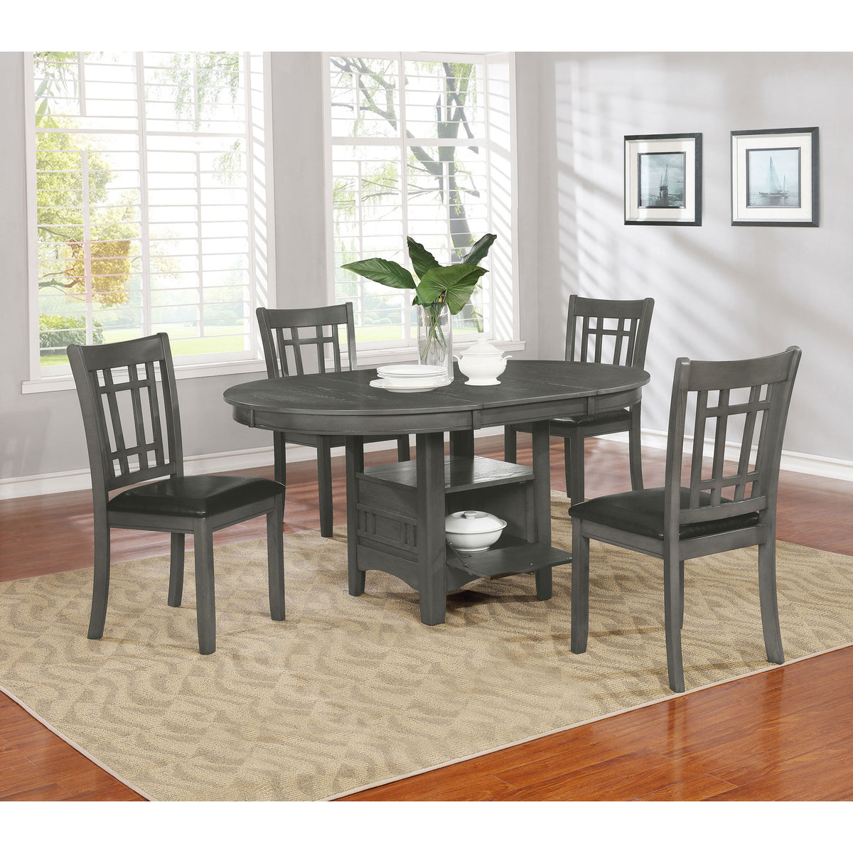 Grey oval dining set with four lattice-back chairs in a bright dining room