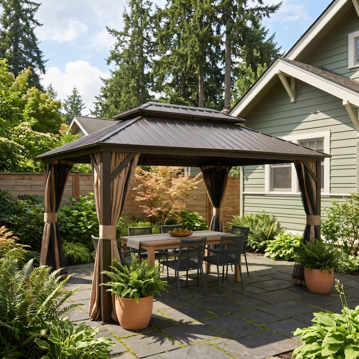 Brown aluminum 10x12 double roof hardtop gazebo with tan curtains over a dining table on a slate patio by a house