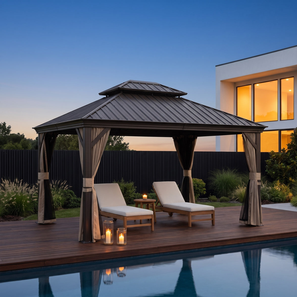 Brown aluminum 10x12 hardtop gazebo with beige curtains over two loungers on a poolside deck at dusk