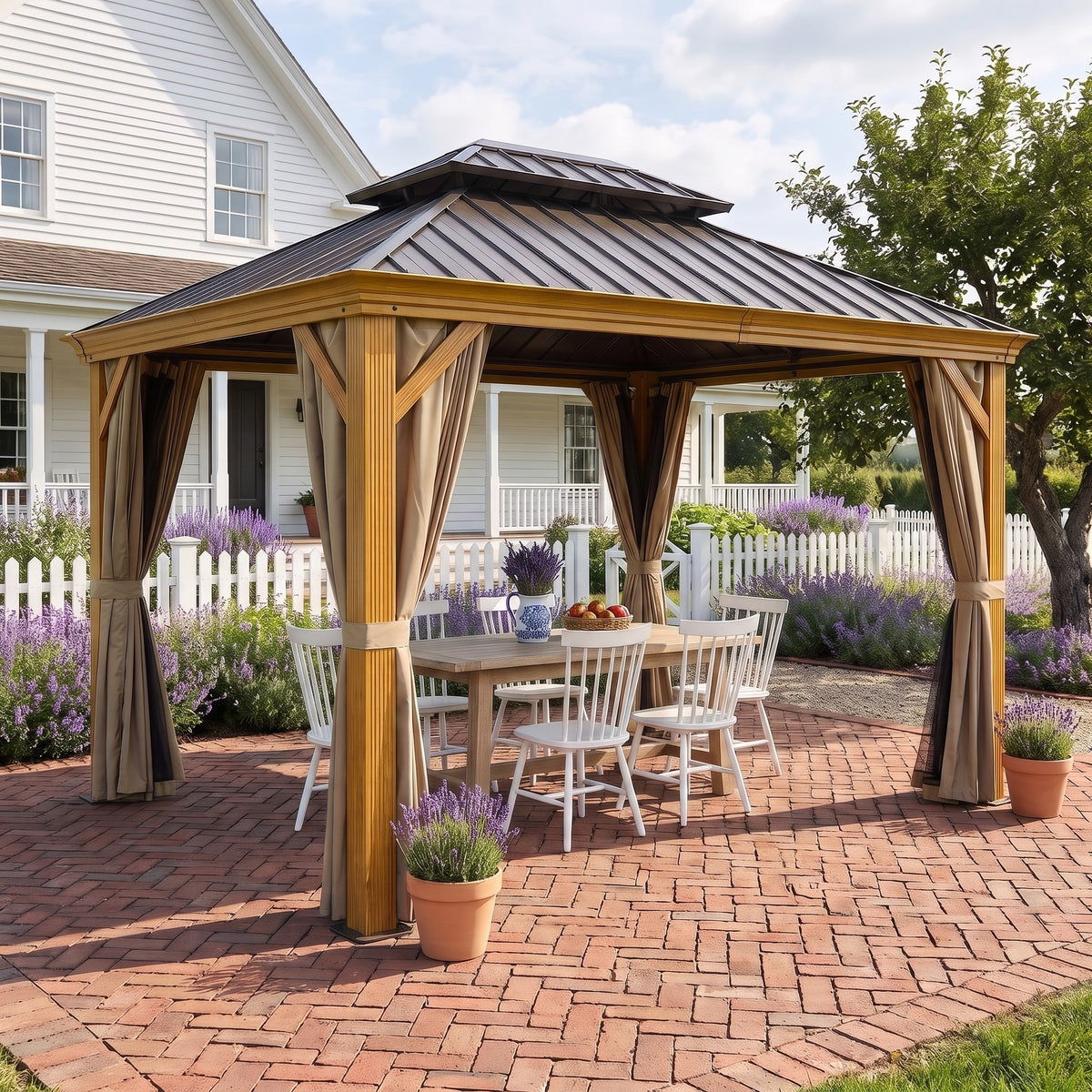 Yellow brown aluminum double roof hardtop gazebo with tied back curtains over a white dining set on a brick patio