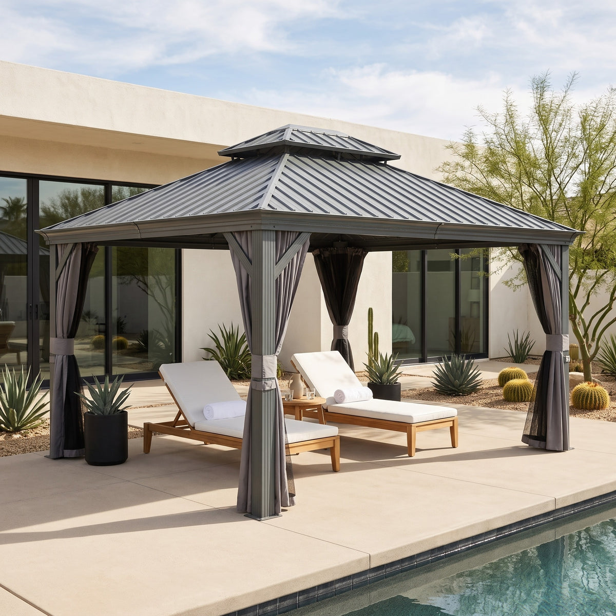 Gray aluminum double roof hardtop gazebo with curtains tied back over two loungers by a pool in daylight