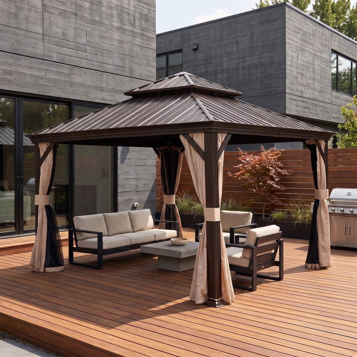 Brown double roof hardtop gazebo with beige curtains over a lounge set on a wood deck beside a modern house