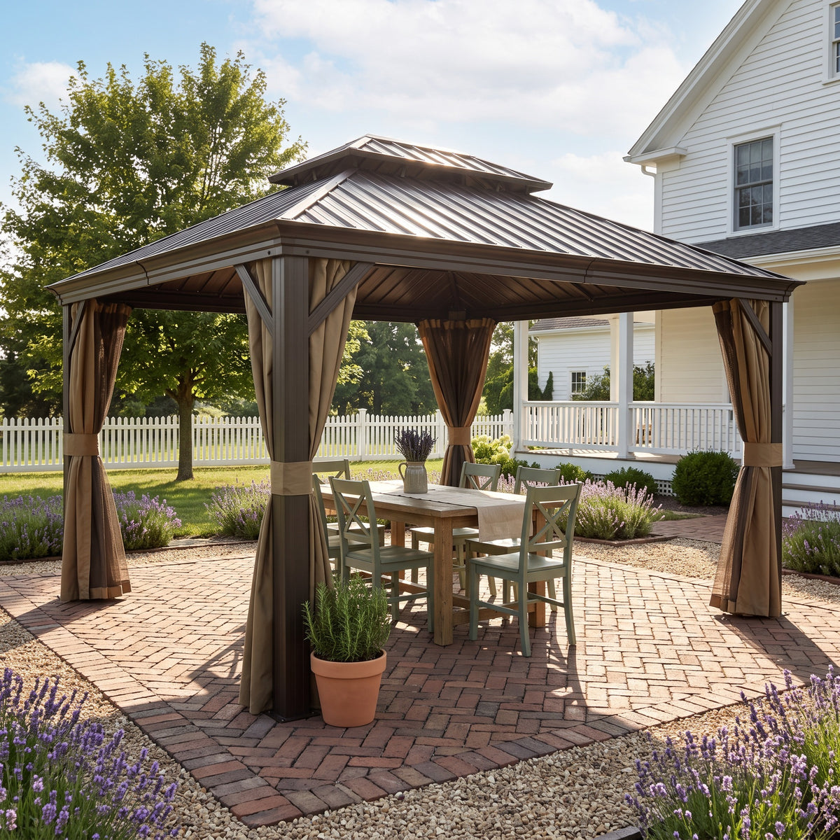 Brown aluminum 12x16 hardtop gazebo with tied back curtains over a farmhouse dining table on a brick patio in daylight
