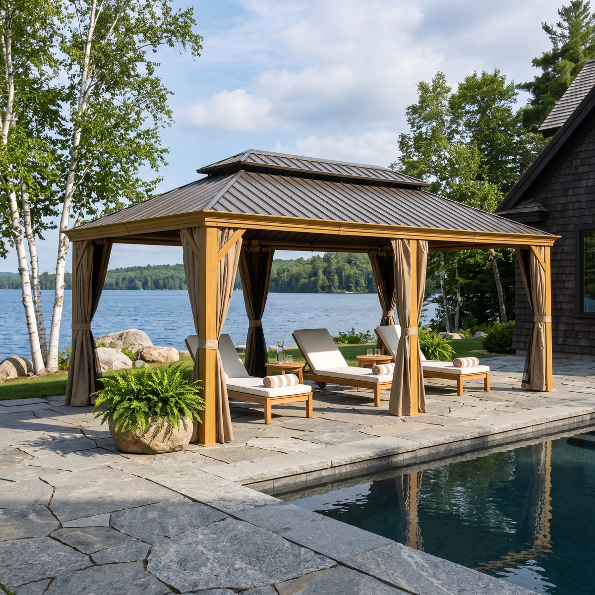 Yellow brown aluminum 12x18 double roof hardtop gazebo with taupe curtains over loungers by a lakeside pool