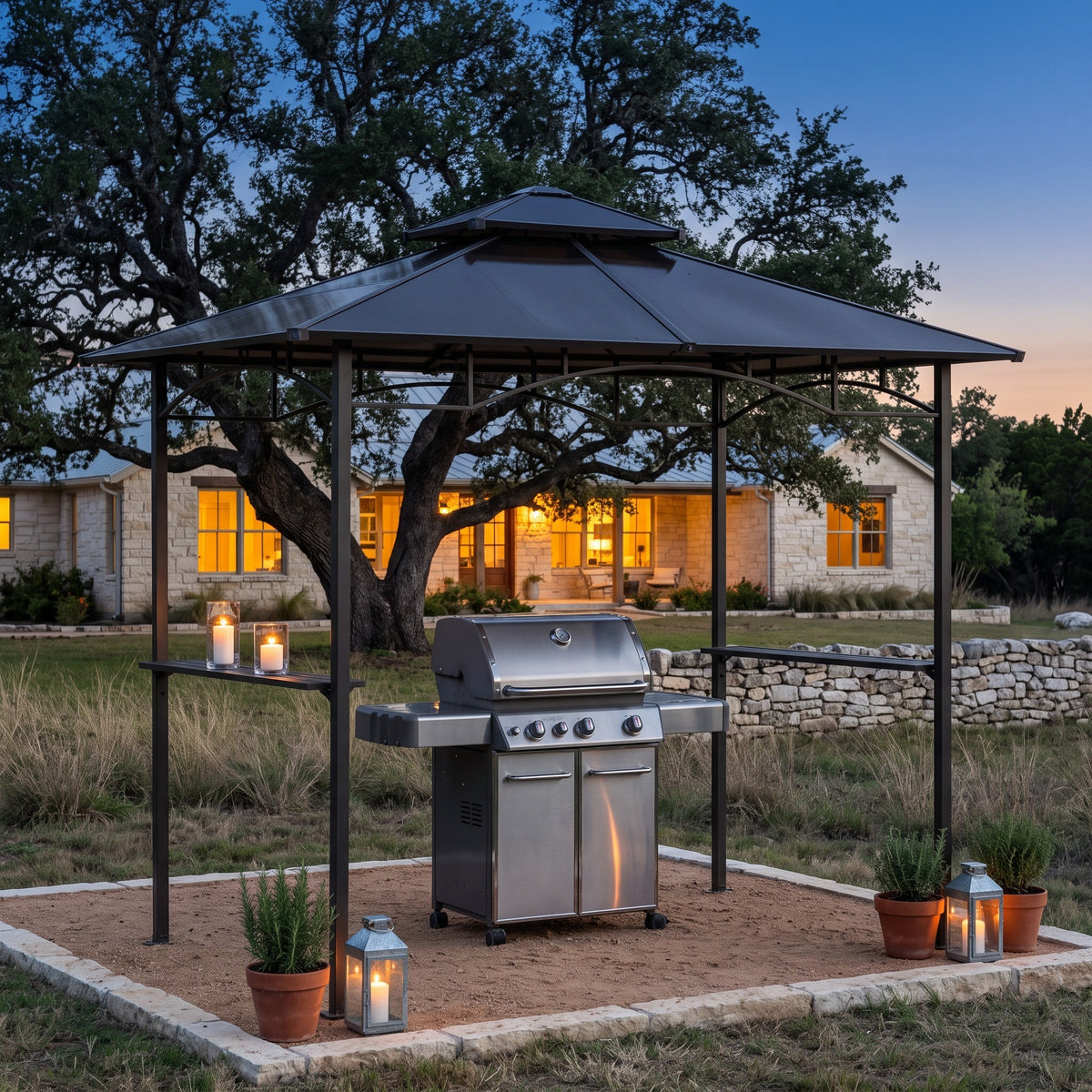Brown metal gazebo with double roof and side shelves over a gas grill on a gravel pad at dusk