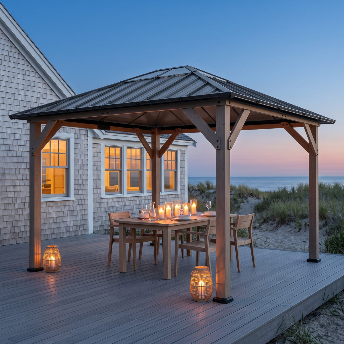 Walnut fir hardtop gazebo with gray steel roof over a candlelit dining table on a beach house deck at dusk