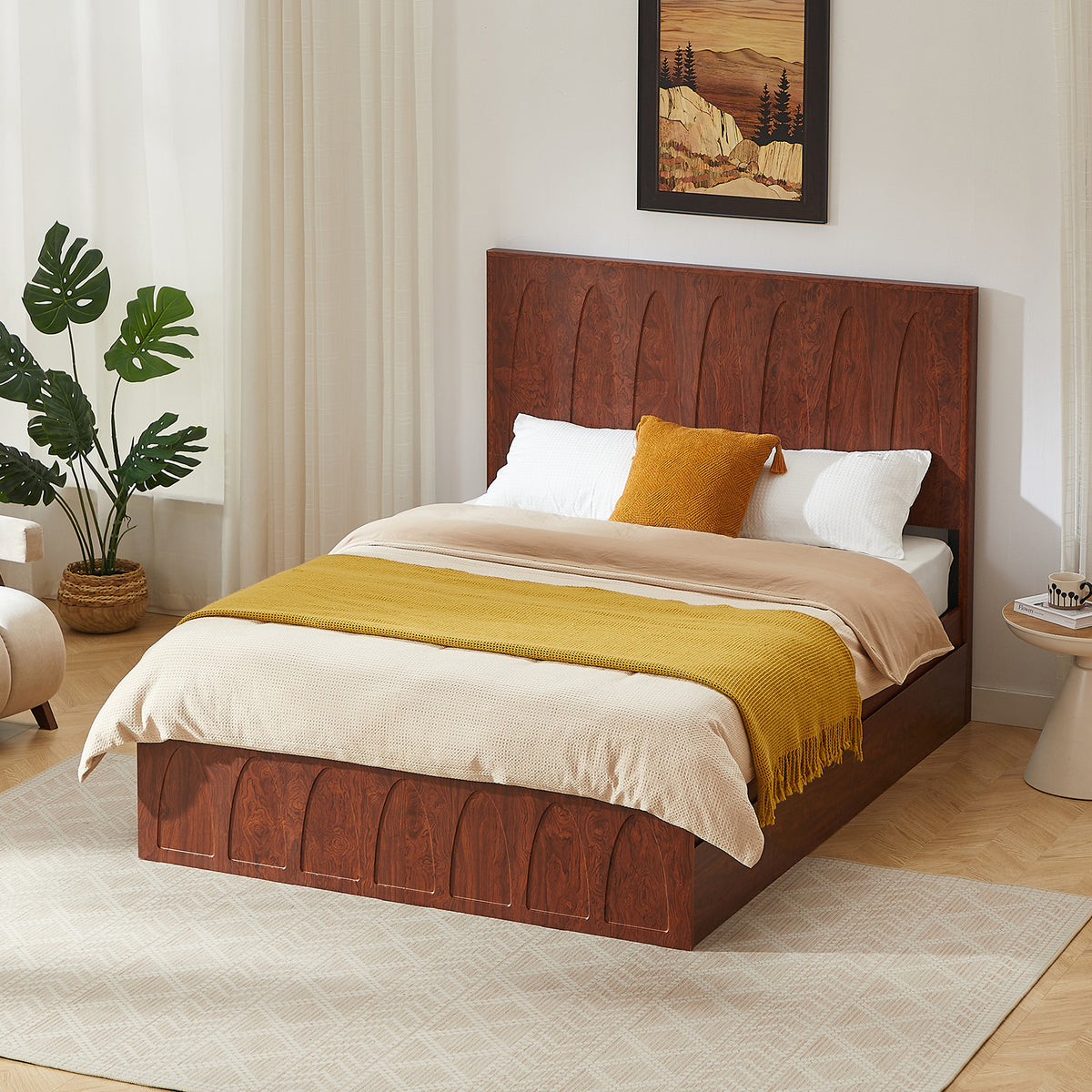 Angled dark reddish-brown wood queen bed in styled bedroom, drawers closed, plant and wall art