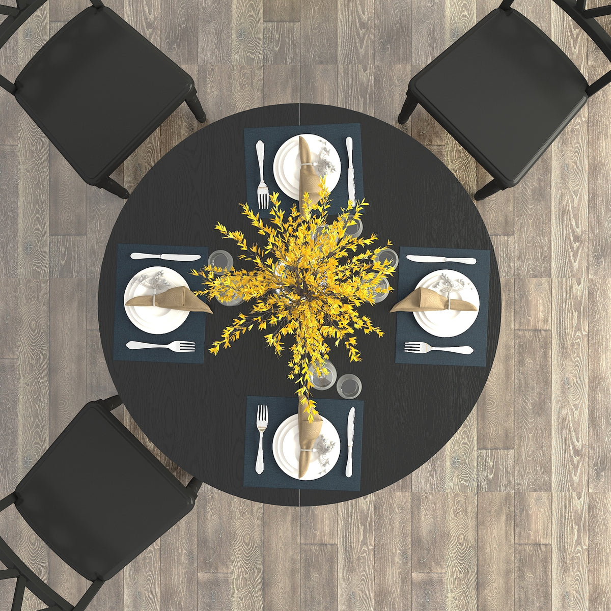 Overhead view of the round black table with four blue placemats and a yellow flower centerpiece