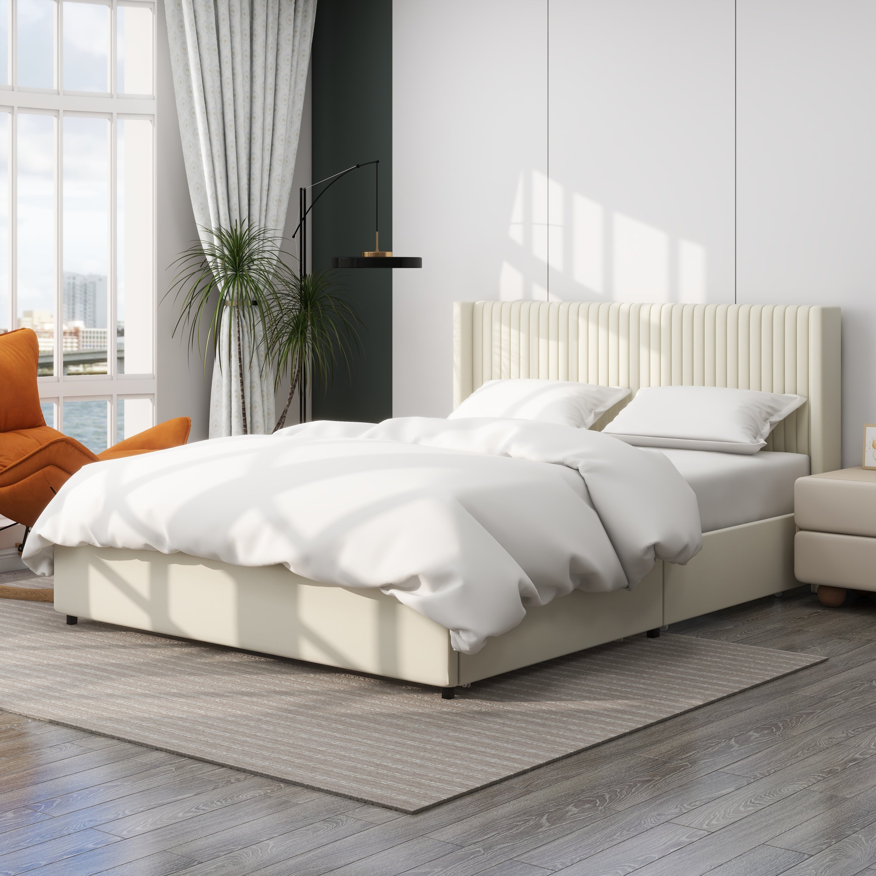 Angled ivory velvet storage bed styled with white bedding, wingback headboard and a nightstand alongside