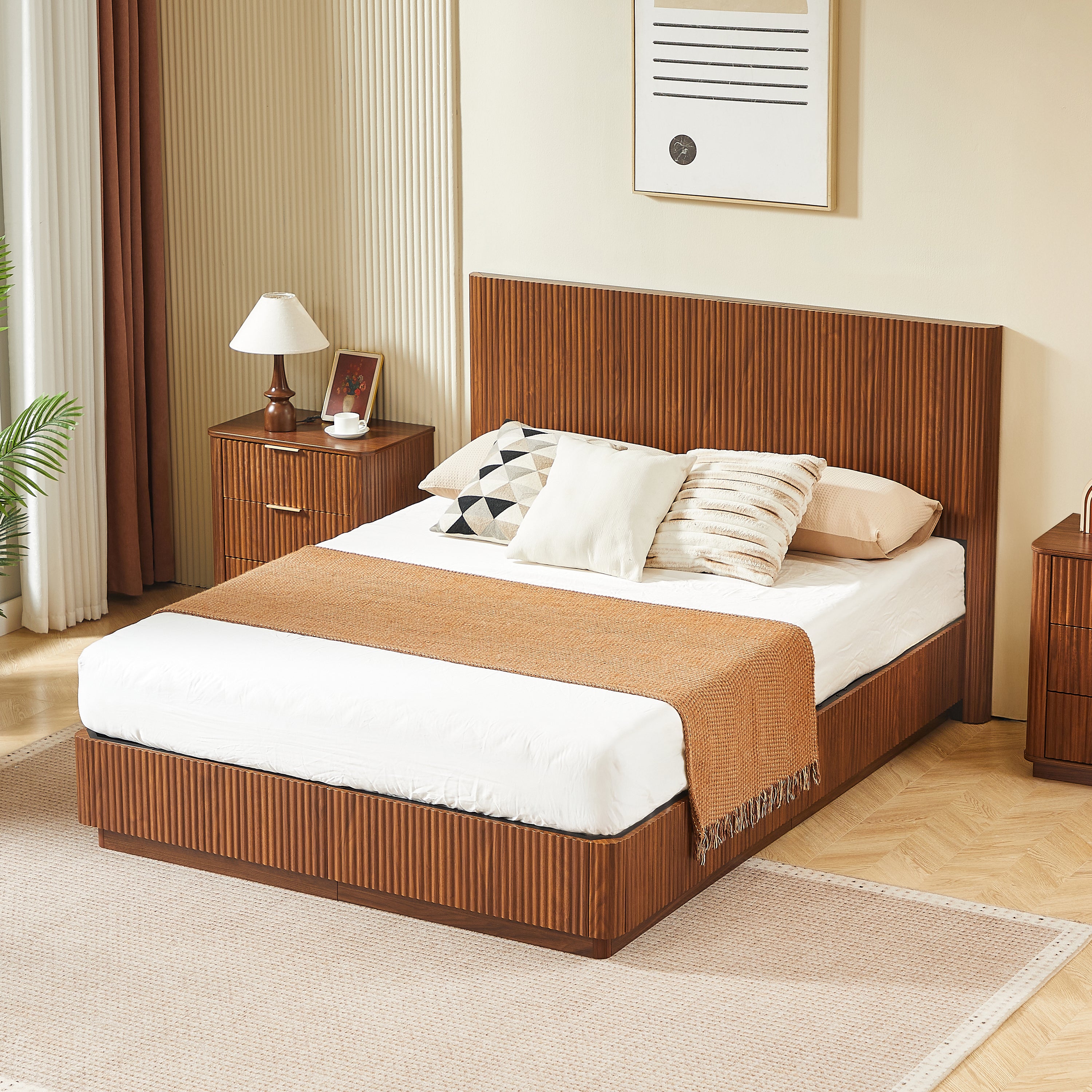 Angled lifestyle view of the modern queen bed frame in walnut, also offered in oak, with layered bedding #Color_Walnut