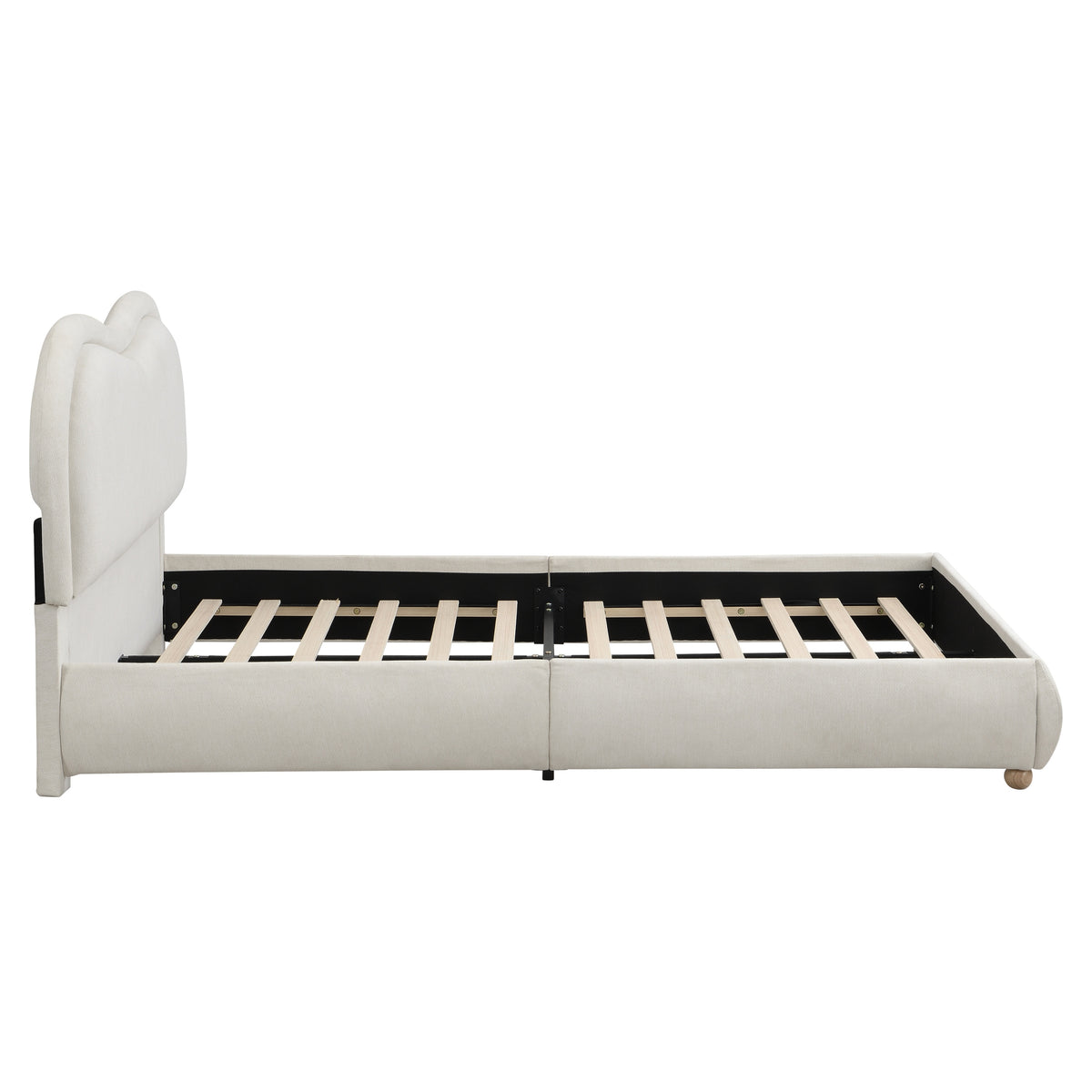 Side profile of beige chenille platform bed frame with rounded rails on white background