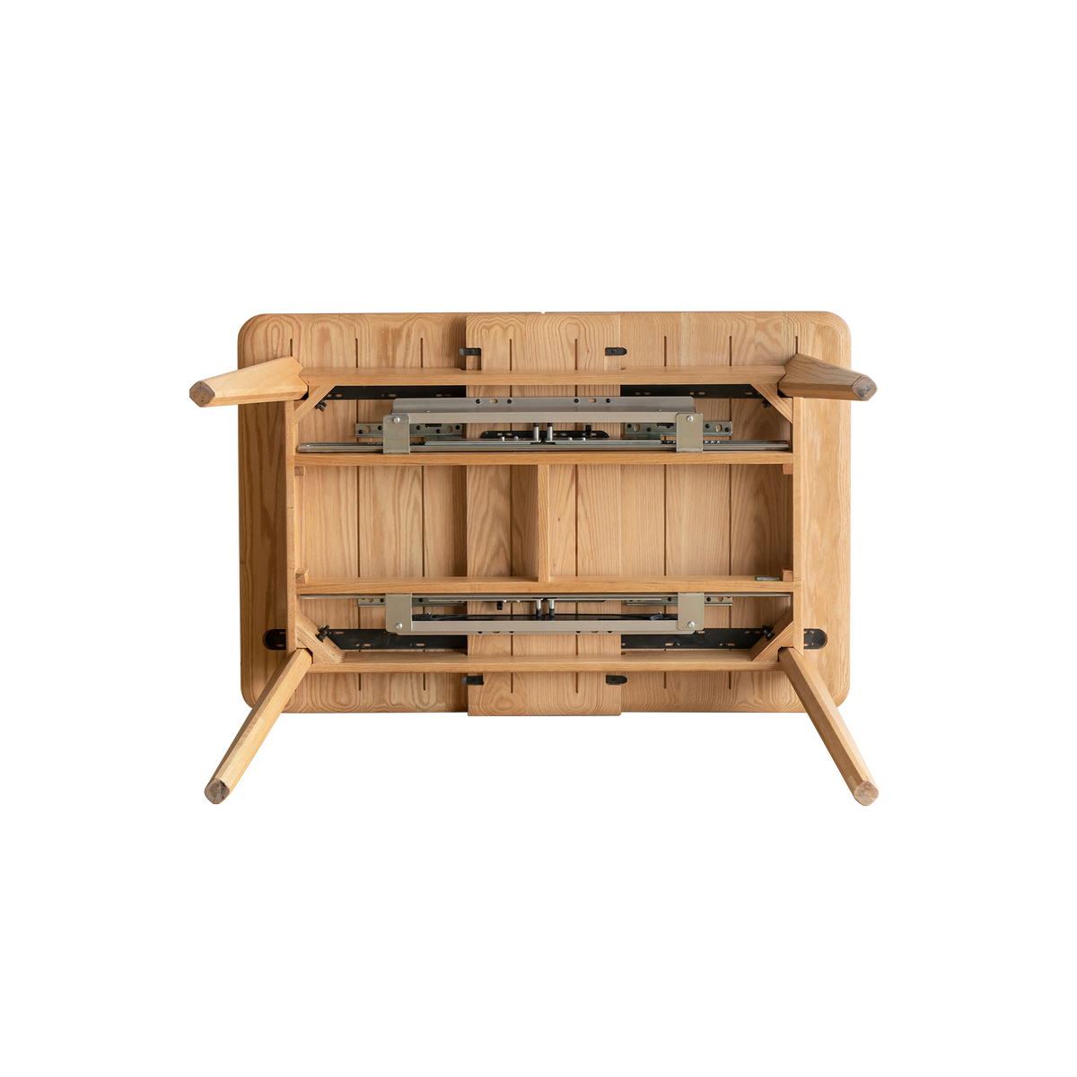 Underside of the natural oak table showing the metal extension slide rails and hardware