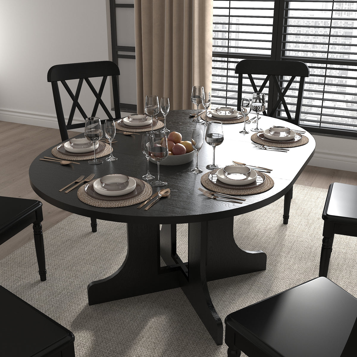 Black oval dining table set for six with black cross-back chairs in a styled dining room