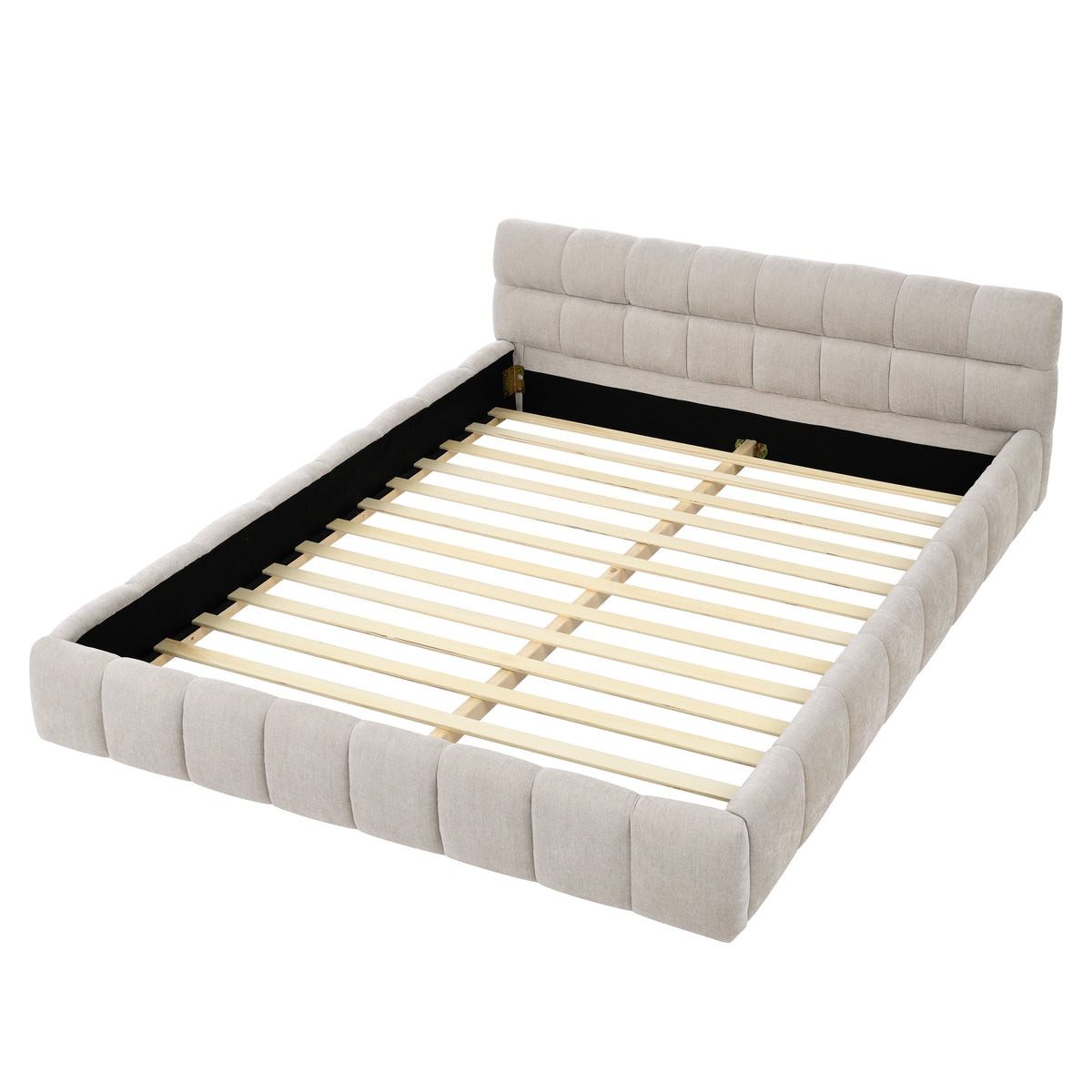 Beige chenille channel-tufted platform bed made up in a bedroom, side angle with wood floor and rug