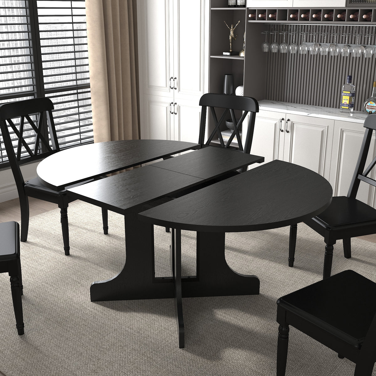 Black table split open with the two rounded halves apart and the folding leaf exposed
