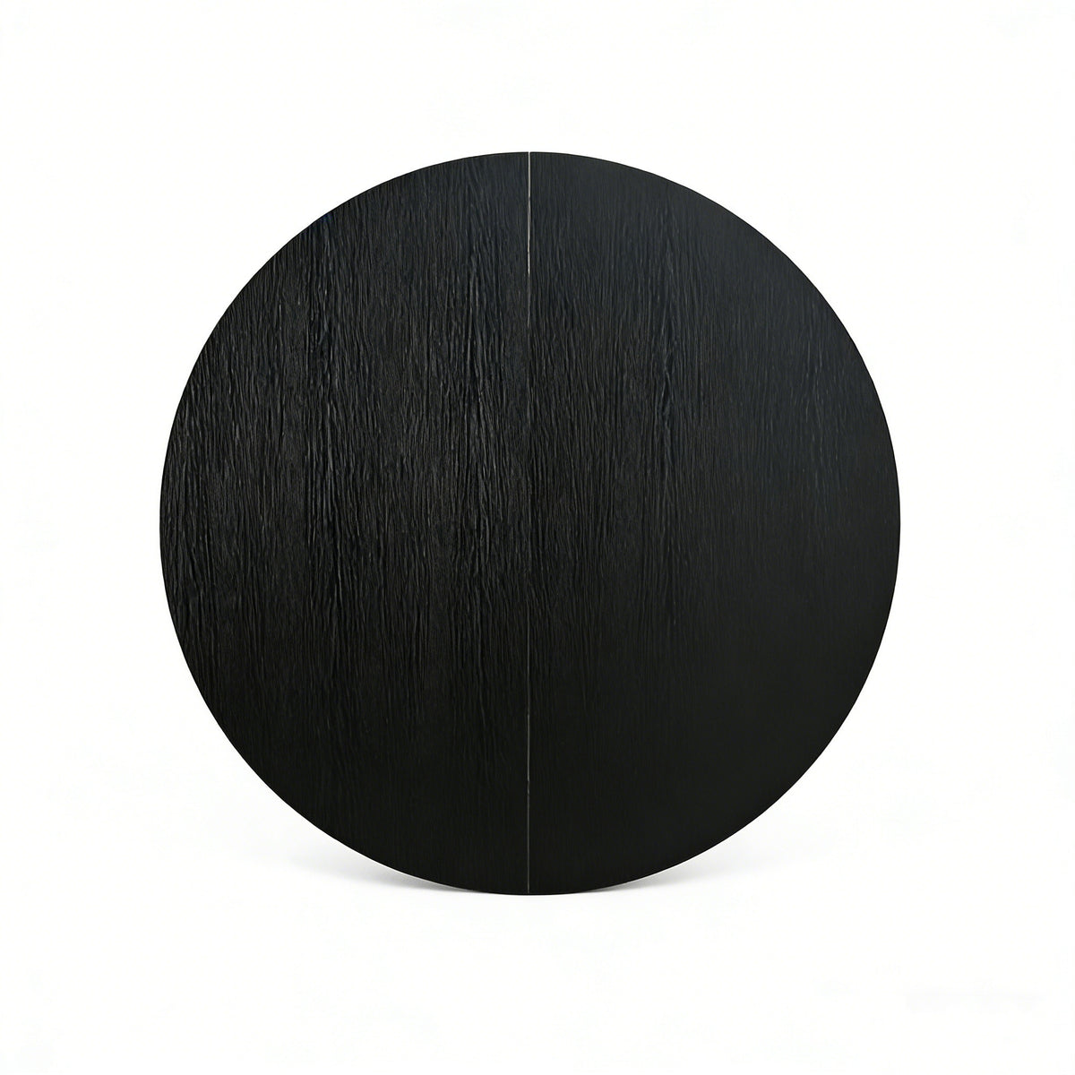 Overhead close-up of the black round tabletop with the center seam